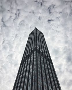 Low angle view of building against cloudy sky