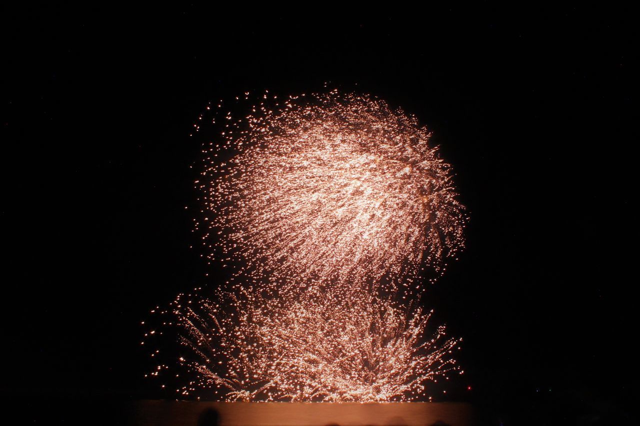 LOW ANGLE VIEW OF FIREWORK DISPLAY