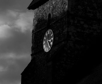 Low angle view of clock tower against sky