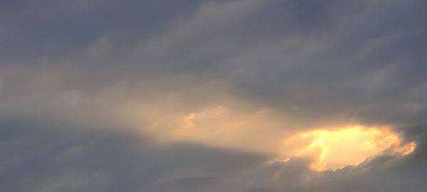 Low angle view of clouds in sky during sunset