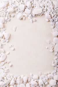 High angle view of pebbles on white background