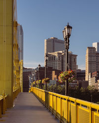 Buildings in city against clear sky