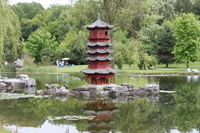 Shrine by lake in park