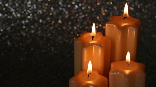 Close-up of illuminated candles during christmas