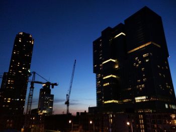 Low angle view of illuminated building at night