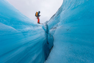 Person skiing on snowcapped mountain