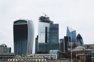 Low angle view of buildings against sky in city