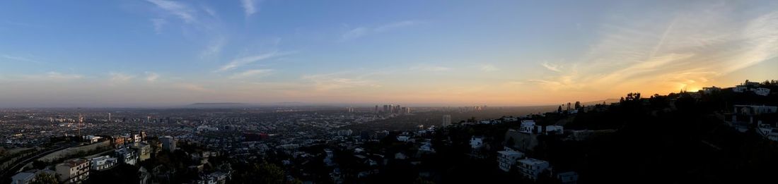 High angle view of city against sky during sunset