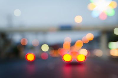 Defocused image of illuminated lights at night