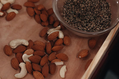 Almond nuts on a wooden table. organic healthy raw vegan food.