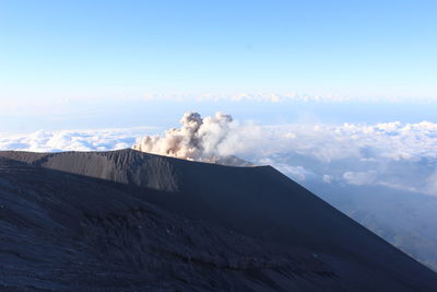 Scenic view of volcanic mountain against sky