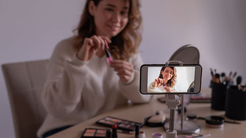 Young woman using mobile phone