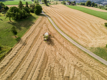 High angle view of combine harvester on agricultural field