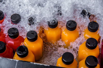 High angle view of drink bottles in ice