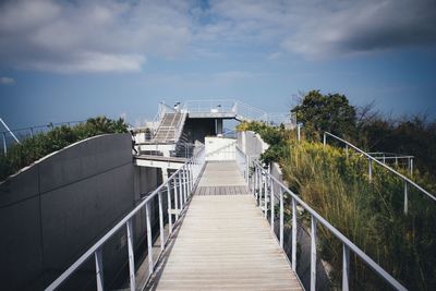 Footbridge against sky