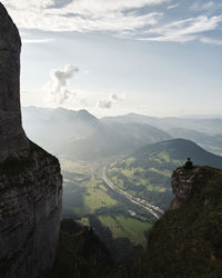 Aerial view of landscape against cloudy sky