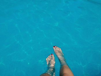 Low section of person in swimming pool