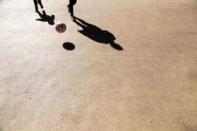 Low section of man on shadow