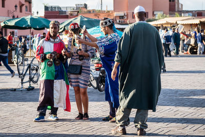 People on street in city