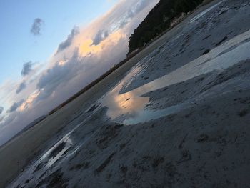 Scenic view of beach against sky during sunset