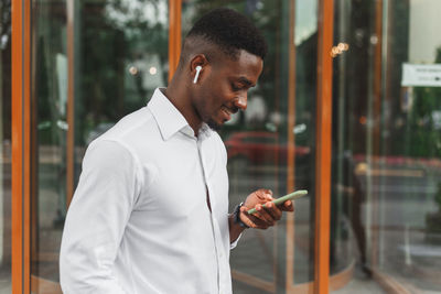 Young man using mobile phone