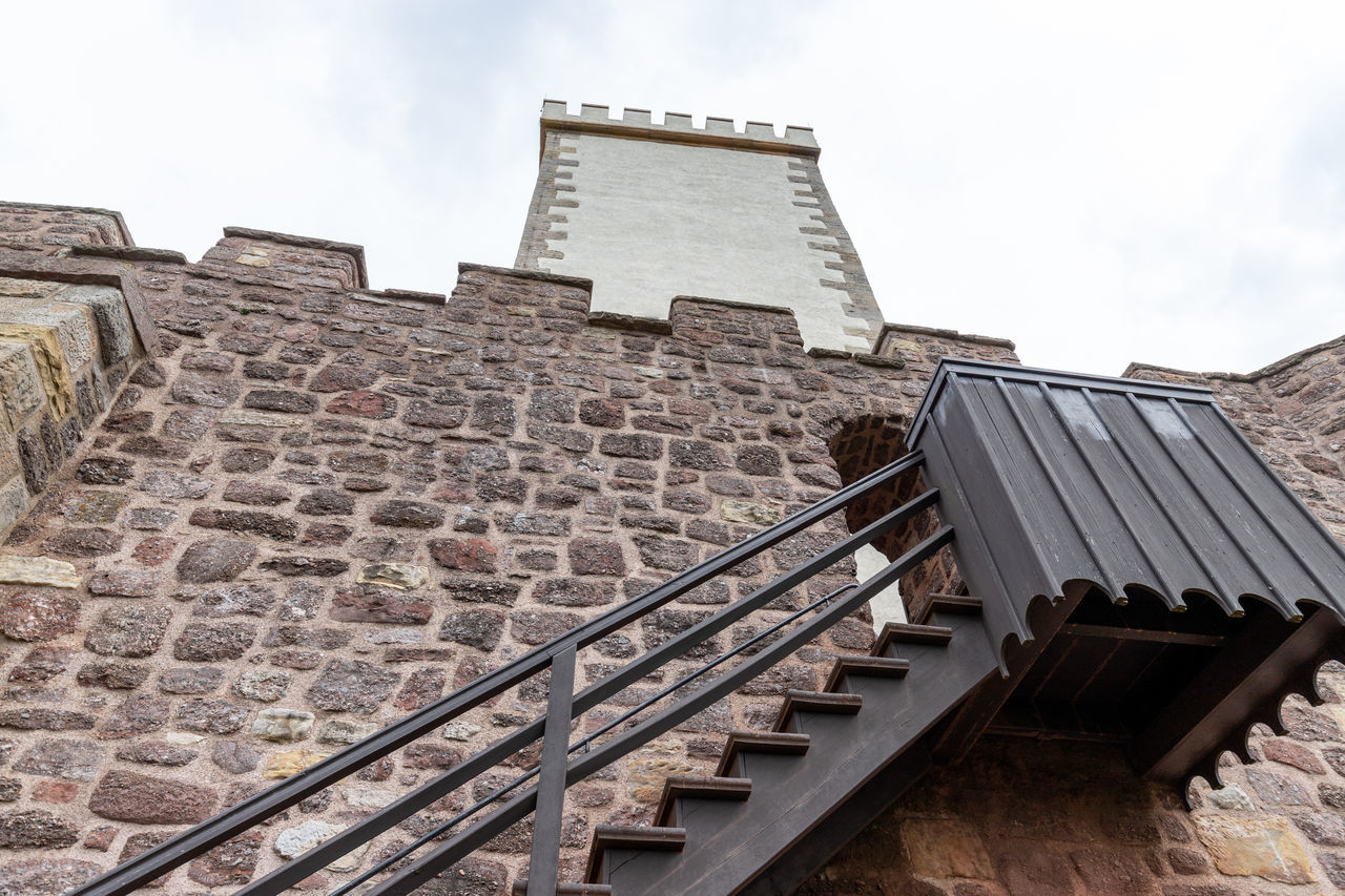 LOW ANGLE VIEW OF STAIRCASE AGAINST BUILDINGS