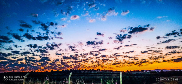 Scenic view of dramatic sky during sunset
