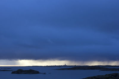 Scenic view of sea against blue sky