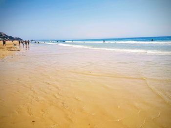 Scenic view of beach against clear sky