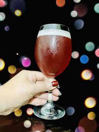 Close-up of hand holding wine glass