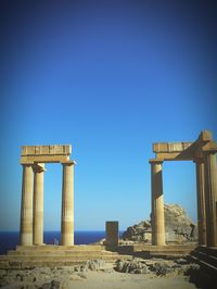 Low angle view of monument against clear blue sky