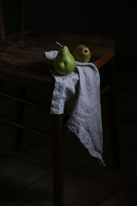 Midsection of woman holding apple