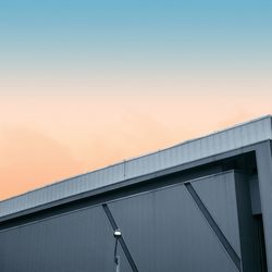 Low angle view of bridge against sky during sunset