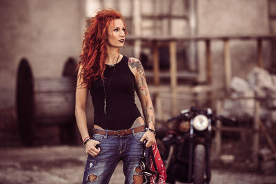 Redhead woman standing on road