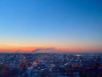 High angle view of city at sunset