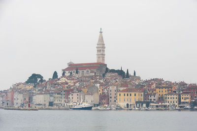 Buildings in city against sky