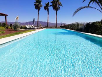 View of swimming pool against blue sky