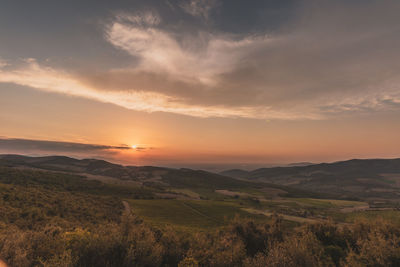 Scenic view of landscape against sky during sunset