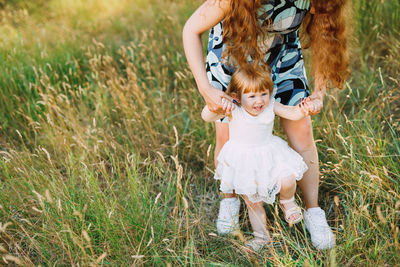 Full length of girl on field