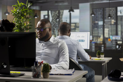 Portrait of young man working in cafe