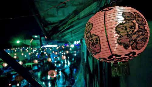 Close-up of illuminated lantern hanging at night