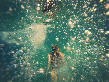 Close-up of woman swimming in water