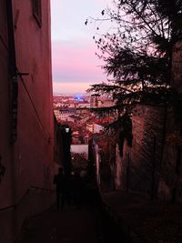 High angle view of street amidst buildings at sunset