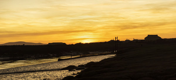 Scenic view of silhouette landscape against sky during sunset