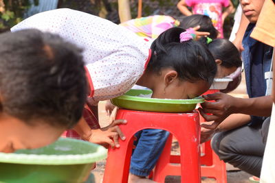 Rear view of people with daughter