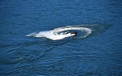 High angle view of person jet boating on sea