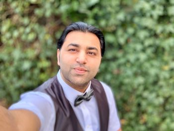 Portrait of young man standing outdoors