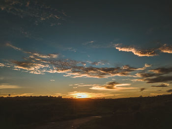 Scenic view of silhouette landscape against sky during sunset