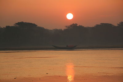 View of calm sea at sunset