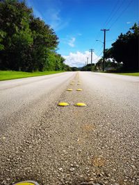 Surface level of road against sky in city